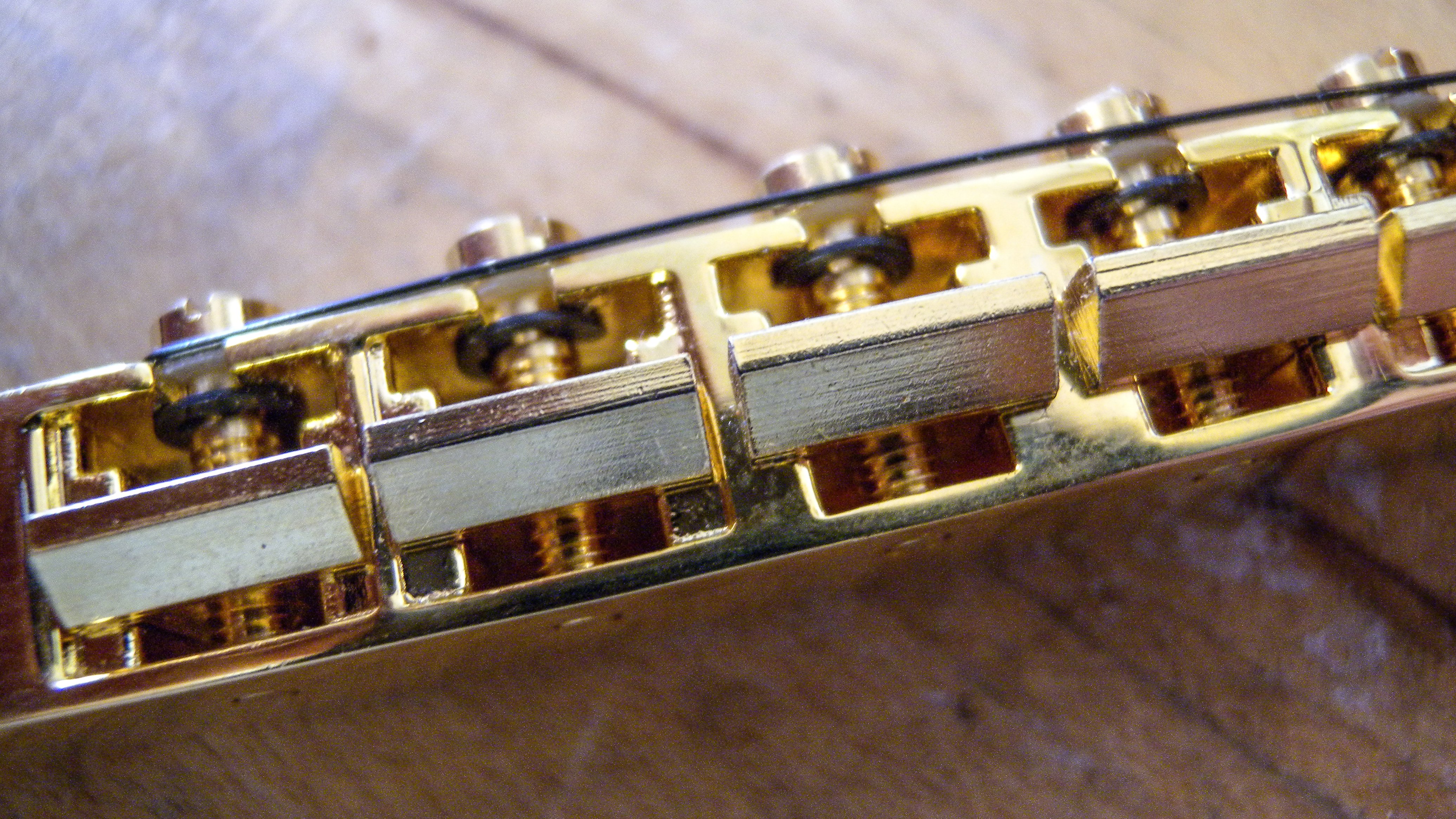 Are you supposed to slot Tune-o-matic bridge saddles? Are you supposed to slot Tune-o-matic bridge saddles?